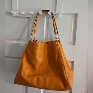 Orange Coach bag with matching wallet